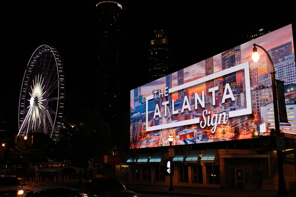 Night view of The Nashville Sign on a large digital billboard.