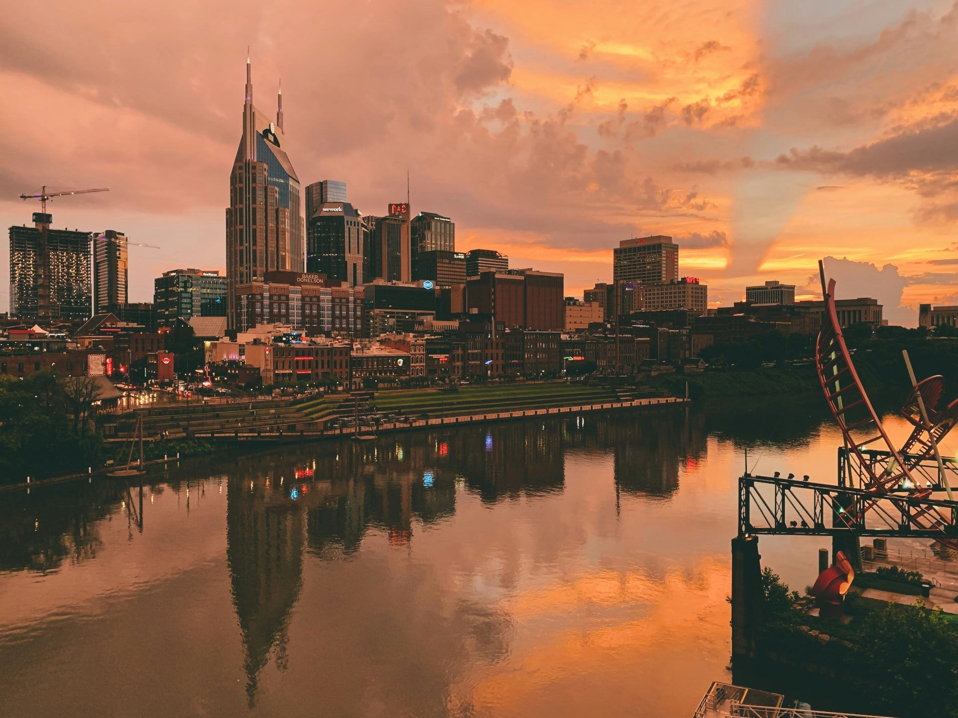 Nashville skyline with sunset over the Cumberland River.